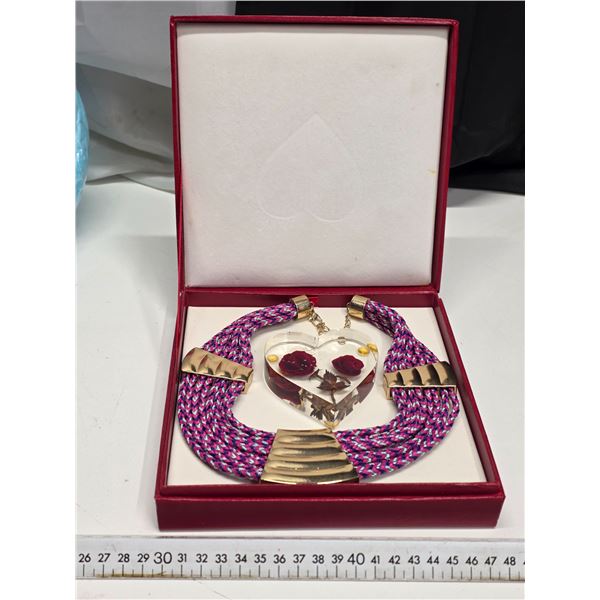 Necklace and heart shaped décor piece