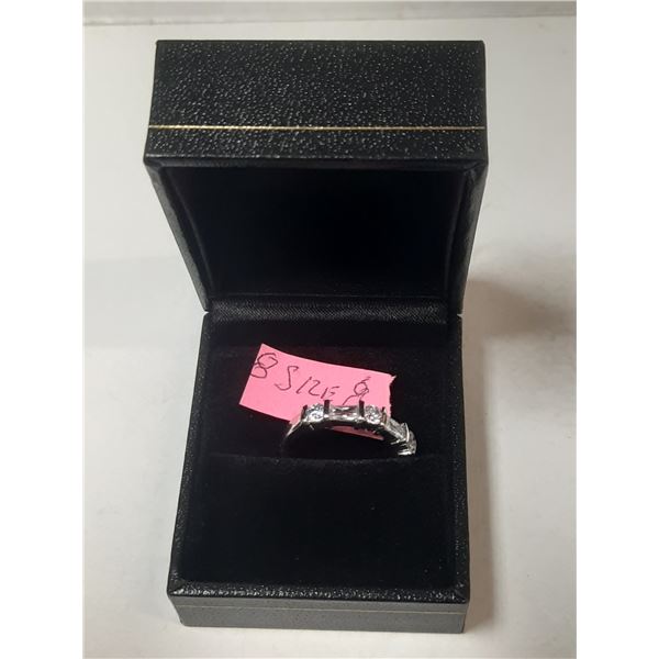 Ladies size 8 ring with 5 clear stones
