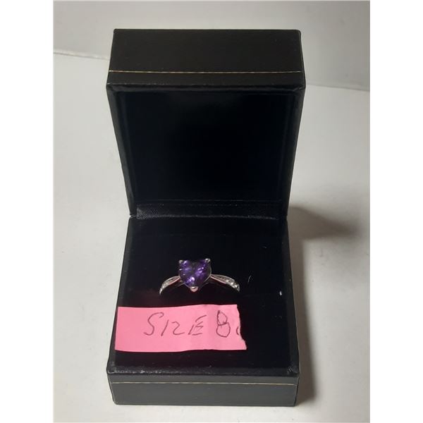 Ladies size 8 ring with purple stones