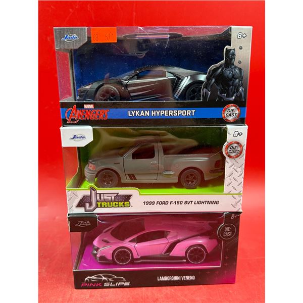 (3) Sealed Die Cast Cars: Avengers Lykan, Just Trucks 1999 Ford F-150 SVT Lightning, & Pink Slips La