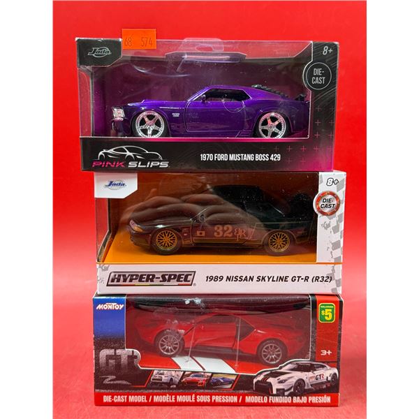 (3) Sealed Die Cast Cars: Pink Slips 1970 Ford mustang Boss 429, Jada 1989 Nissan SKyline GT-R, & Mo