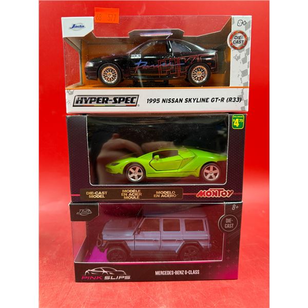 (3) Sealed Die Cast Cars: Jada 1995 Nissan Skyline GT-R, Montoy, & Pink Slips Mercedes-Benz G-Class