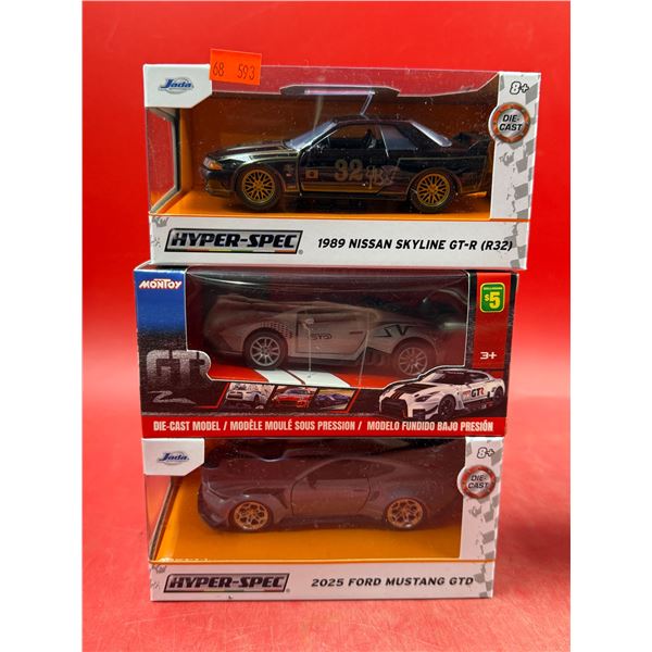 (3) Sealed Die Cast Cars: Jada 1989 Nissan Skyline GTR, Montoy Sports Car, & Jada 2025 Ford Mustang 