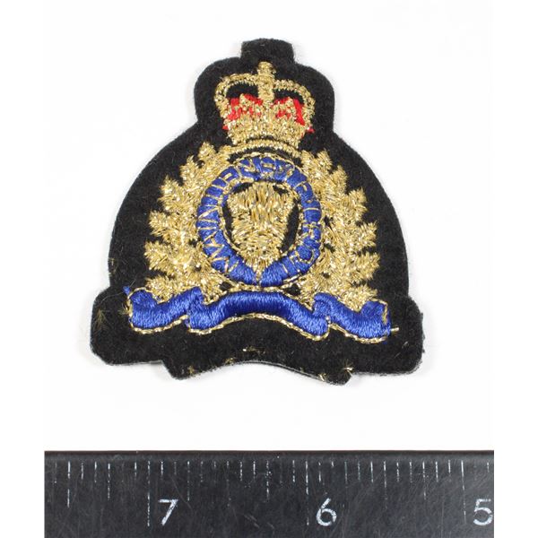 #569 Late 1900's Cloth RCMP Padded Cap Badge