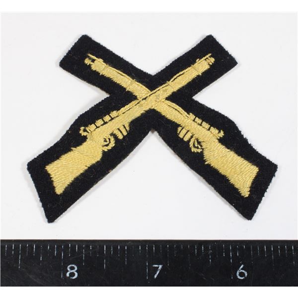 #609 Early RCMP Cloth Crossed Rifles Insignia