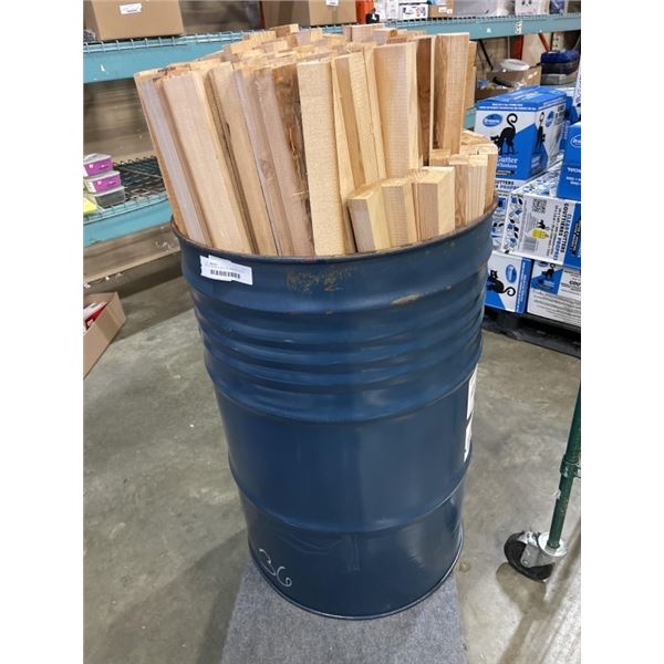 METAL BARRELL FULL OF HEMLOCK WOOD PIECES, 1" X 2" X 43"