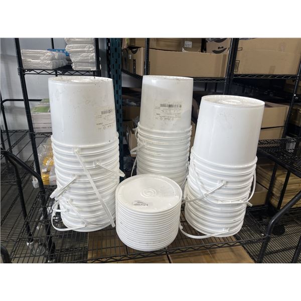 STACK OF WHITE BUCKETS AND LIDS