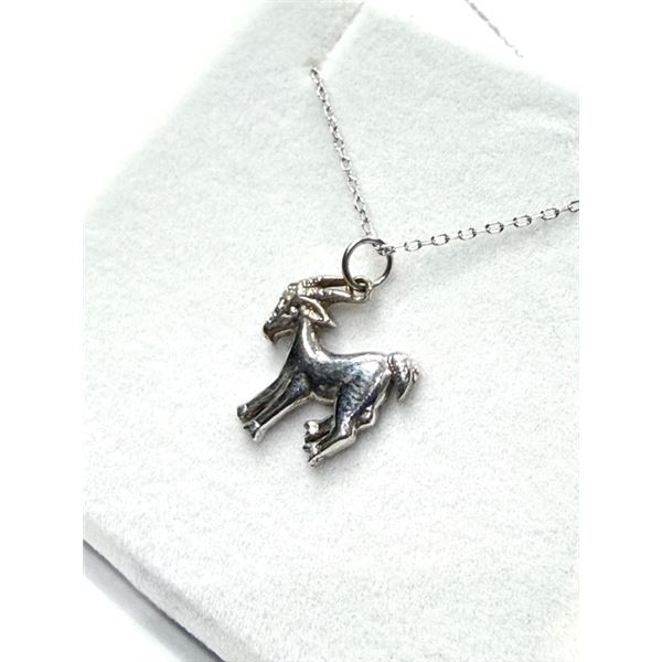 10KT WHITE GOLD NATURAL DIAMOND (0.01CT) CAPRICORN PENDANT WITH STERLING SILVER CHAIN, W/A $1000.00.