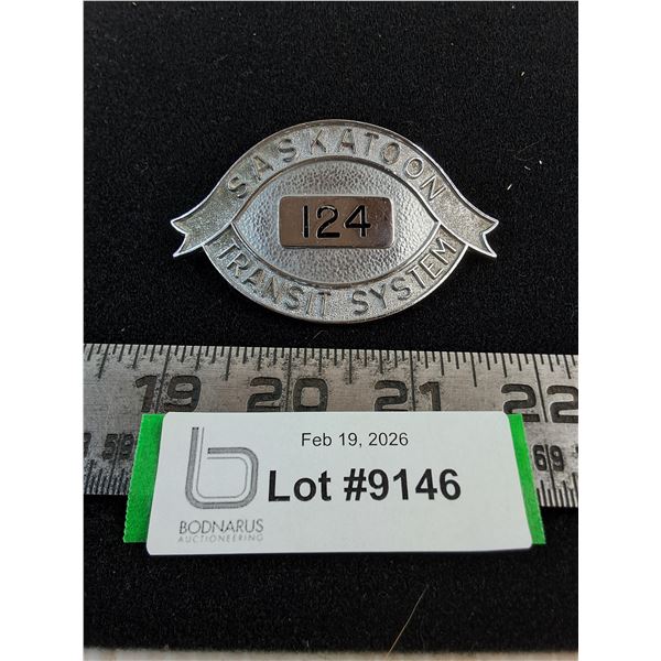 Brass "Saskatoon Transit System - #124" Badge