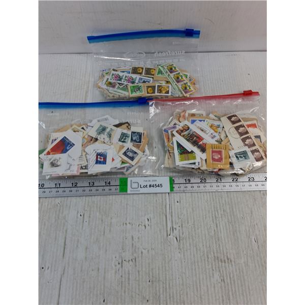 (3) Bags of Assorted Stamps-300 Stamps in Each Bag