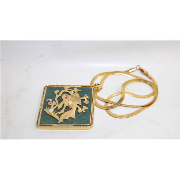 GENUINE GEMSTONES INLAID ON A CARVED GOLD KOI FISH