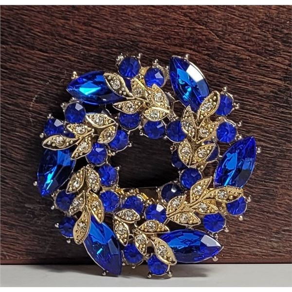 17)  SILVER TONE WITH SAPPHIRE BLUE AND