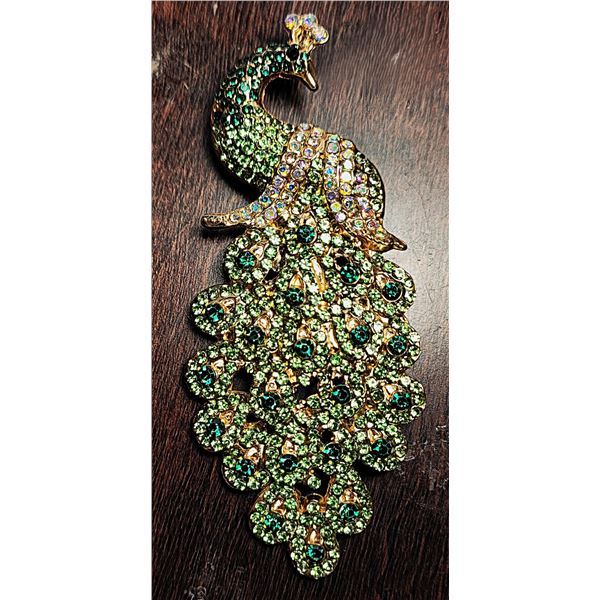 18)  GOLD TONE WITH GREEN AND IRRIDESCENT