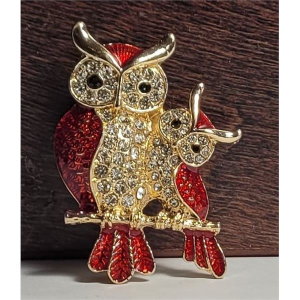 11)  GOLD TONE WITH RED ENAMEL AND CLEAR