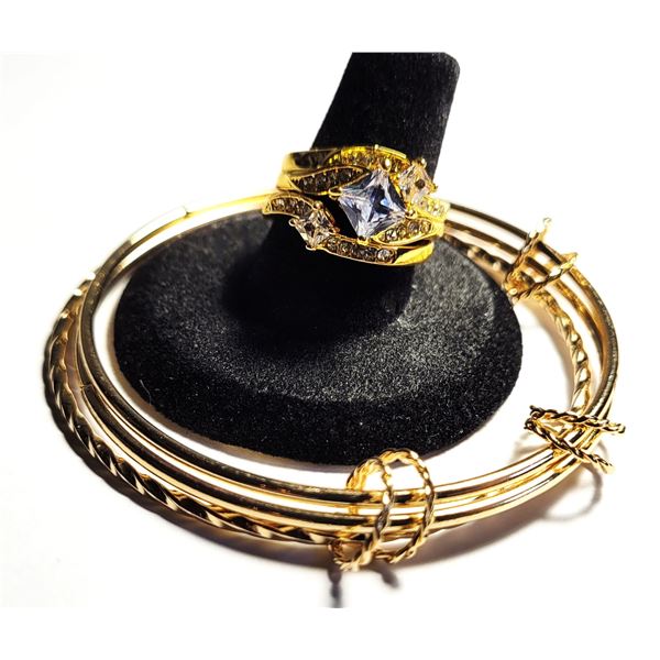 31)  GOLD TONE SET OF 3 BANGLE BRACELETS