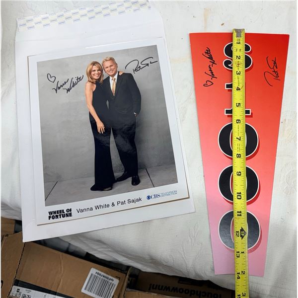 WHEEL OF FORTUNE AUTOGRAPHED VANNA WHITE AND PAT SAJAK PHOTOGRAPH AND AUTOGRAPHED PRIZE WEDGE