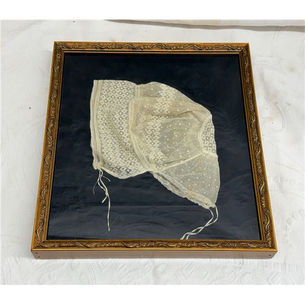 ANTIQUE FRAMED CHILD'S BONNET MADE OF FINE HAND-EMBROIDERED NET LACE