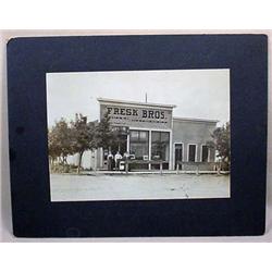C. 1911 MOUNTED PHOTO OF FRESK BROS. STOREFRONT IN
