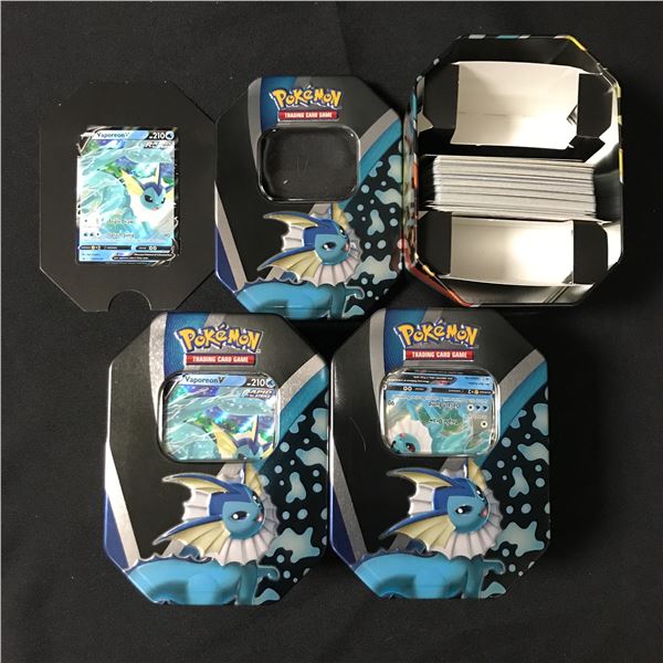 LOT OF 3 VAOPERON TINS 1 VAPOREON TRADING CARD AND SEVERAL LOOSE CARDS