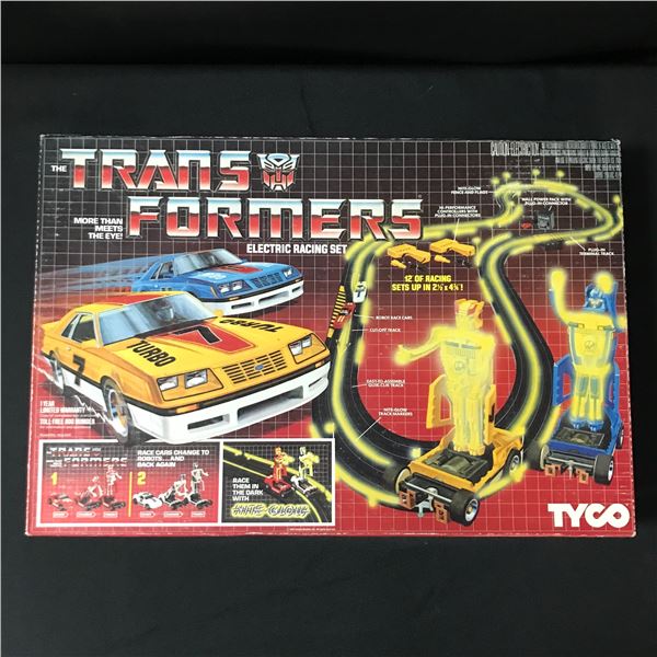 COMPLATE IN MINT CONDITION 1985 TYCO TRANSFORMERS ELECTRIC RACING SET  IN ORIGINAL PACKAGING