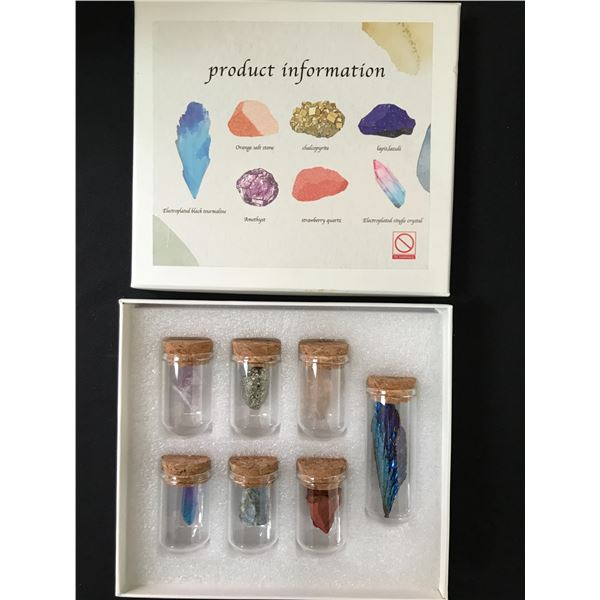 SET OF 7 CRYSTALS IN VIALS AND COMMEMORATIVE CASE INCLUDING STRAWBEERRY QUARTZ AND AMETHYST