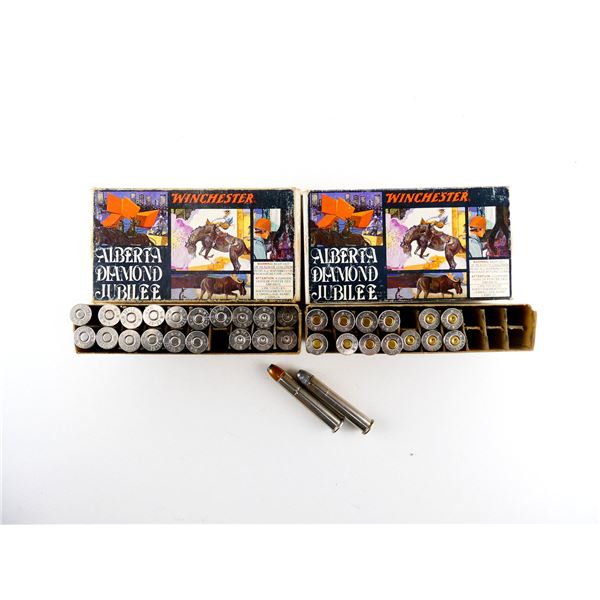 COLLECTIBLE ALBERTA DIAMOND JUBILEE WINCHESTER .38-55 WIN AMMO AND NON-PRIMED NICKEL CASES LOT