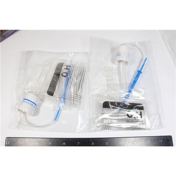 TWO UNUSED WATER DRIPPERS. INSTRUCTIONS ON BAG