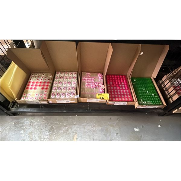 SHELF OF ASSORTED LUCK'S DEC-ONS SUGAR DECORATIONS: RABBITS, SHAMROCKS, HEARTS & MORE