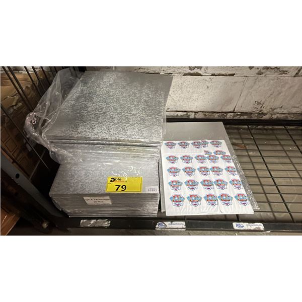 SHELF OF ASSORTED SILVER WRAPPED CAKE BOARDS: ONE IS PAW PATROL