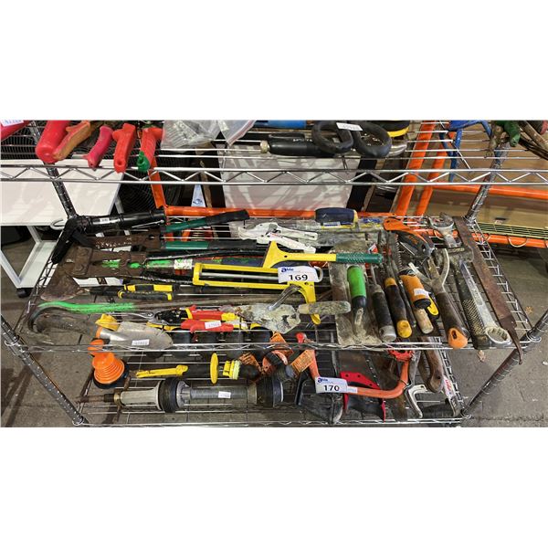 SHELF OF ASSORTED HAND TOOLS: TROWELS, WRENCHES, AX, BOLT CUTTER & MORE