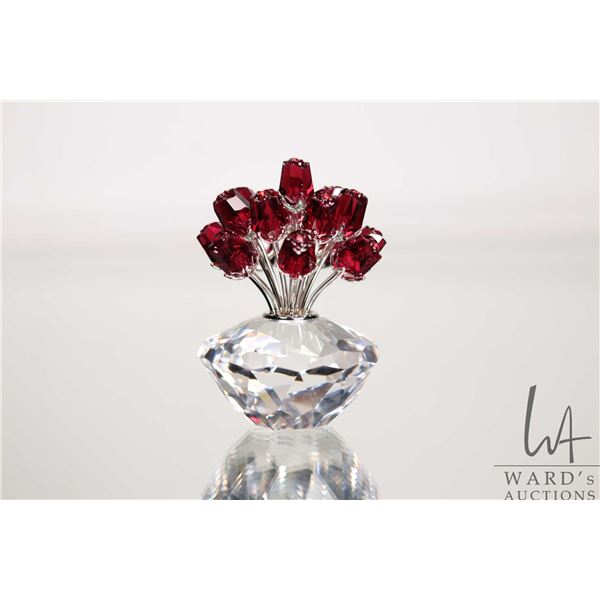 Swarovski crystal vase of red roses. no. 283394, 2 3/4" in height. Designed for the 15th anniversary