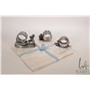 Image 1 : Three antique Victorian silver plate napkin holders including cherub pulling a sledge, Easter chick 