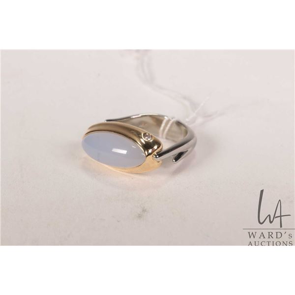 18kt yellow and white gold ring set with 5.50ct light lavender chalcedony quartz cabochon cut gemsto
