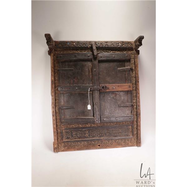 Antique East Asian wooden window with hand carving and hand hammered detailing, overall dimensions 2