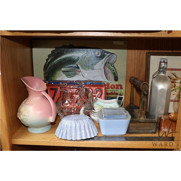 Shelf lot of vintage and antique collectibles including sadiron, one gallon stoneware crock, oil lam