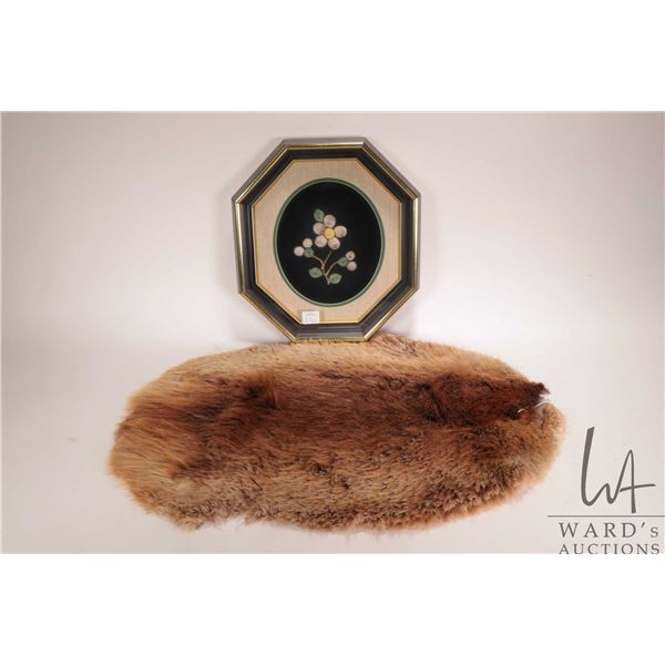 Moose tufting in octagonal frame, overall dimensions 11-1/2" x 10-1/2", and a 20" x 15" beaver pelt