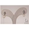 Image 1 : 10kt white gold and fresh water cultured pearl earring set with single cut round diamonds. Retail re