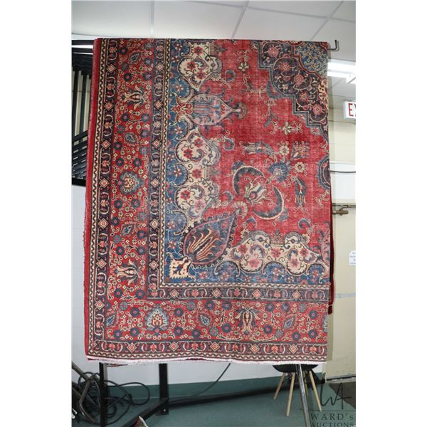 Iranian wool carpet "Tabriz" with center medallion, overall floral design on red background with hig
