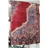 Image 1 : Iranian wool carpet "Mashad" with center medallion on red background with floral border and highligh