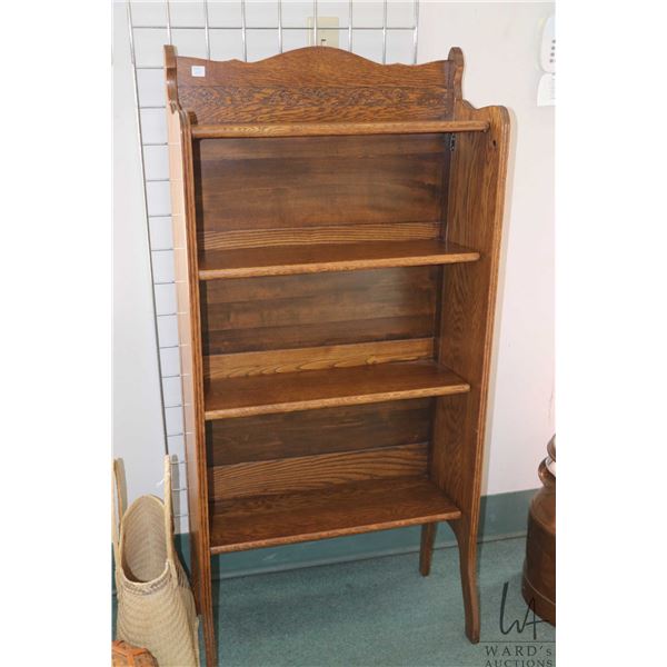 Unique oak folding four tier bookshelf with carved back, 51 1/2" in height, 24" W X 10 1/2" D