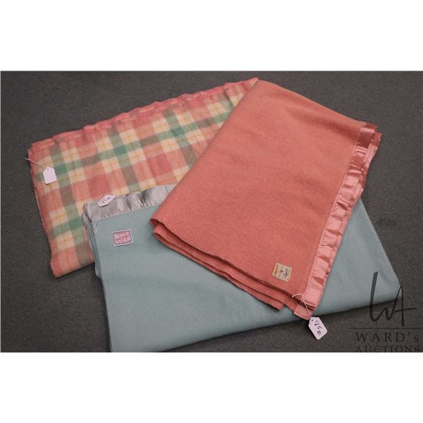 Three wool blankets including pink 83" X 63", green 19" X 71" and plaid 86" x 71"