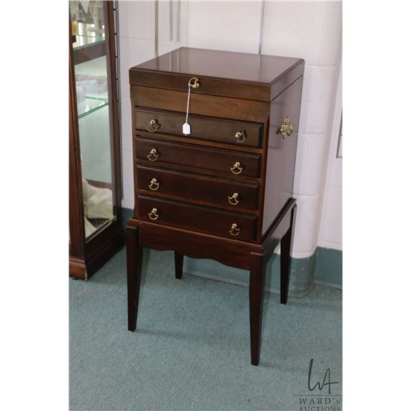 Four drawer, flip up lid flatware case made by the Bombay Company, note: chest is on separate stand,