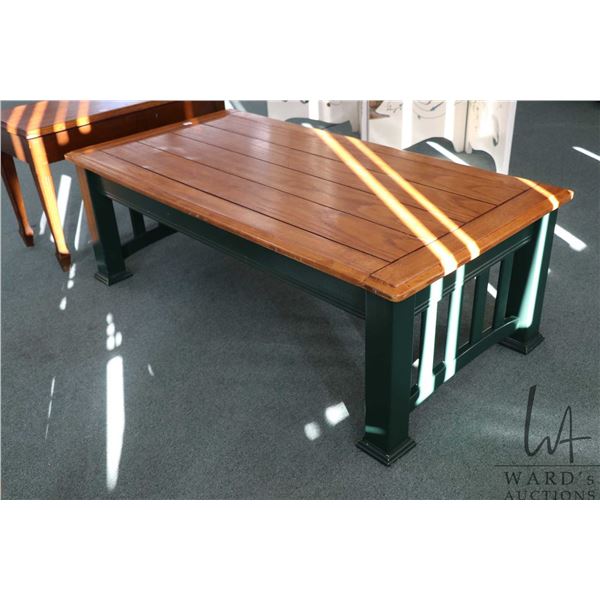 Green painted coffee table with slat style top and mechanism for raising to dining table height, 16"