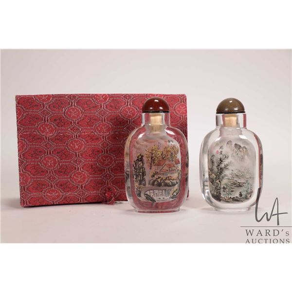 Two reverse inside painted "Mystic China Mountain Scene" snuff bottles