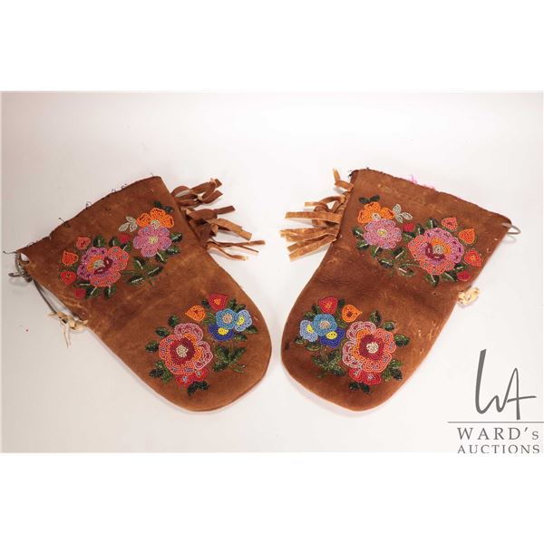 Pair of Canadian Indigenous gauntlet mittens with beaded Ojibway rose design and wool liners