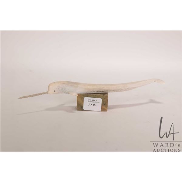 Inuit whalebone carved narwhal on soapstone plinth, retains part of it's original Eskimo Art label a