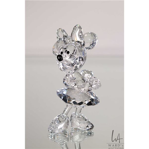 Swarovski crystal Disney "Minnie Mouse" no. 687436, 4 1/2" in height. Includes original box and a mi