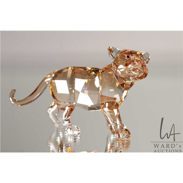 Swarovski amber crystal standing baby tiger no. 101667, 2 1/4" in height. Includes original box