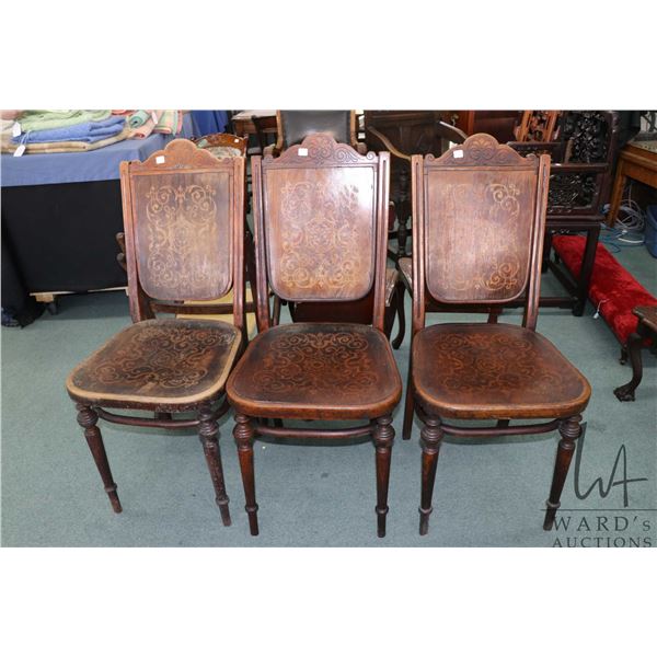 Three antique Thonet bent wood dining chairs with printed seats and backs