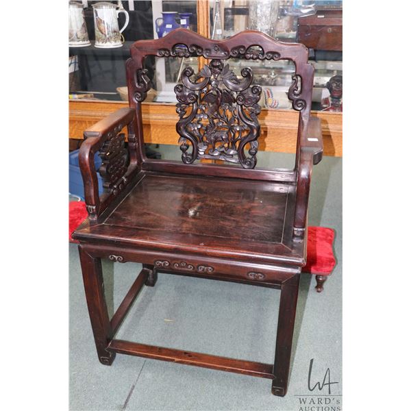 Antique Oriental rosewood chair with 21" H seat and delicately carved back panel